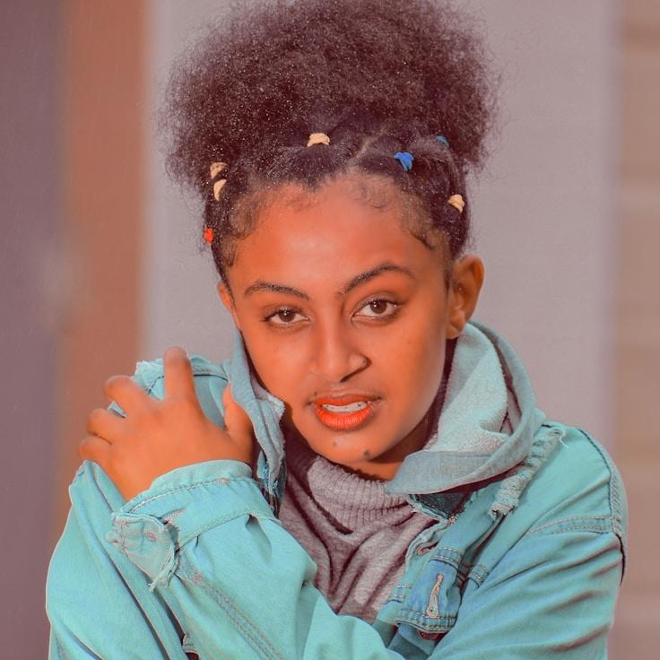 Kaveri Mehta, Lead Design Curator at Mariner System Sandy, reviewing corporate floral arrangements